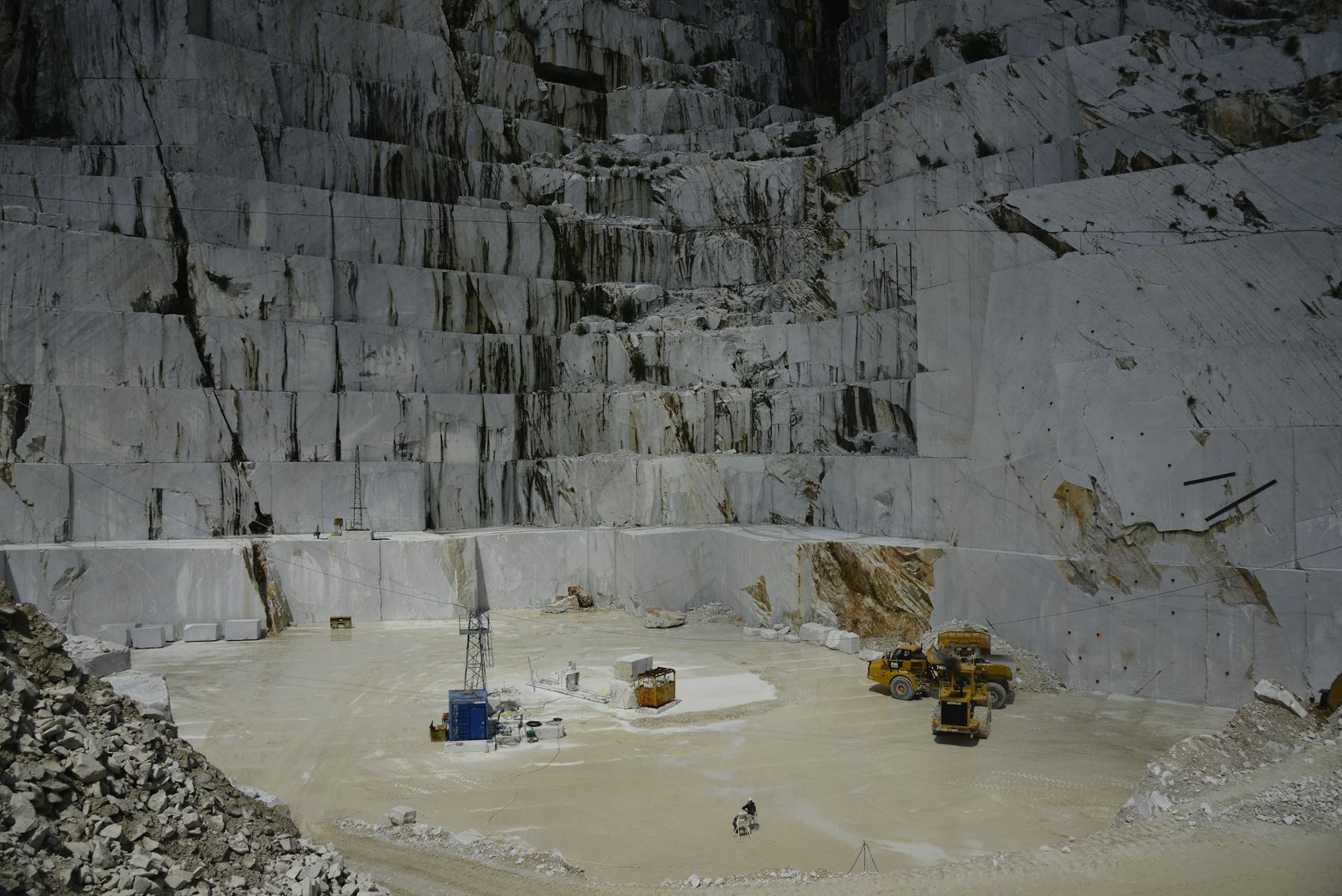 Stepped white marble benches in a quarry pit